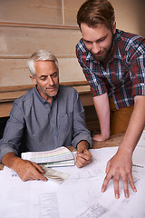 Image showing Architects, collaboration and men with blueprint in office for building, construction or repairs. Engineering, design and industrial apprentice planning and working on industry project with mentor.