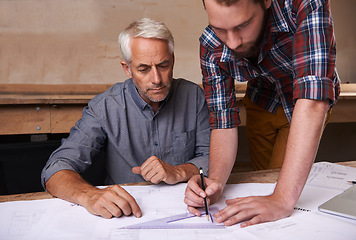 Image showing Architects, collaboration and men with blueprint in workshop for building, construction or repairs. Engineering, design and industrial apprentice planning and working on industry project with mentor.