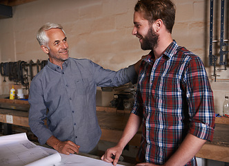 Image showing Carpenter, team and men with blueprint for planning construction project or father teaching son. Engineer, apprentice and happy senior mentor with design, bonding and support for training at workshop