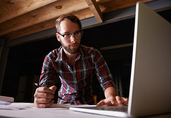 Image showing Architect, drawing and man with laptop, blueprint and engineer with internet and digital app with network. Person, startup or entrepreneur with construction and online planning for renovation or idea