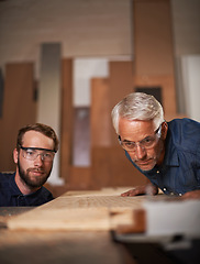 Image showing Workshop, wood and father with son, teamwork and construction with property development and cooperation. Family, parent and collaboration with maintenance and planning with solution, tools and gear