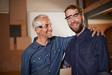 Image showing Man, embrace and smile with wood, workshop and family business or apprenticeship. Mature father, son and hug with artisan, carpentry and together for startup and mentor or learning with happiness