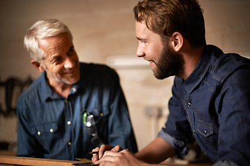 Image showing Man, job and smile with wood, workshop and family business or apprenticeship. Father, adult son and design with artisan, carpentry and together for startup and mentor or learning with happiness