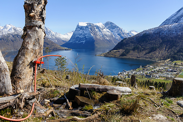 Image showing Scenic overlook of a pristine fjord with snow-capped mountains o