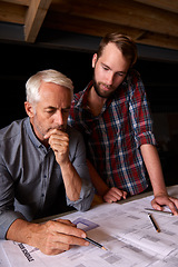 Image showing Engineer, team and men with blueprint, thinking or plan for construction with serious father teaching son. Architecture, apprentice and senior mentor drawing design for problem solving in workshop