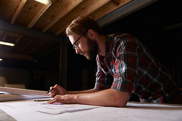 Image showing Man, architect drawing blueprint and engineering for construction, renovation project and design for building. Floor plan, sketch and property development with architecture and creativity in workshop