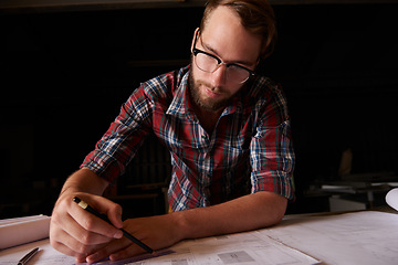 Image showing Man, architect and table or paper, thinking and working on planning for construction. Architecture, building or engineering for infrastructure, design and contractor or career for remodel for measure