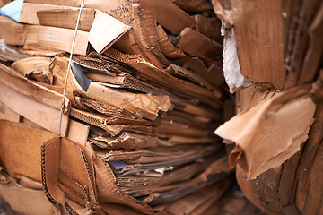 Image showing Recycle, cardboard or box of garbage in outdoor for waste management, junk yard trash or rubbish. Community, background, organised closeup of junk material with dump collection, litter or scrap pile