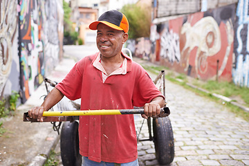 Image showing Garbage, cart or man in city walking for waste management, recycling or rubbish in neighborhood. Portrait, collector or happy person with junk material in Brazil for dump collection, litter or scrap