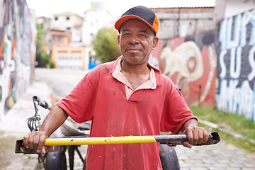 Image showing Man, portrait and cart for garbage in street for smile, walk and collect trash for recycling for ecology. Person, rickshaw or barrow for sustainability, environment and nature on road in Sao Paulo