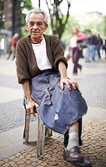 Image showing Relax, business or old man in a chair or city for peace in retirement, neighborhood or Sao Paulo. Outdoor break, thinking and elderly male person in street with apron, job labor and wisdom in Brazil