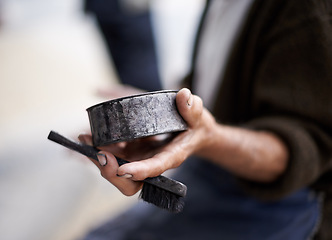 Image showing Street, polish or hands of man in cleaning service in city for shine or shoes with wax, trade and job. Closeup, labour or person with toothbrush in downtown Sao Paulo for footwear or outdoor help