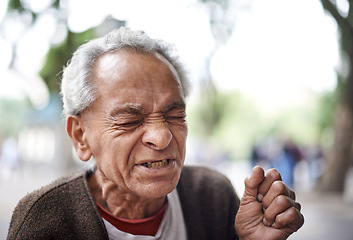 Image showing Face, sick and old man sneezing in a street or city in retirement, neighborhood and town. Sao Paulo, flu illness and elderly male person with hay fever, hardship and wisdom in outdoor area and Brazil