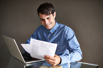 Image showing Business, documents and happy man with laptop in office for accounting, planning or budget review. Financial, savings and male accountant with paper, invoice or startup growth, profit or sales report
