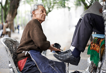 Image showing Shine, shoes or old man in city, street or cleaning service for client or customer with polish, trade or job. Chair, senior or feet of businessman in downtown Sao Paulo for footwear or outdoor help