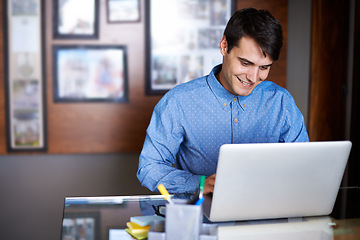 Image showing Businessman, laptop and typing in workplace professional, salesman and working in office. Male person, smile and happy with computer or research, corporate and technology for connectivity or project