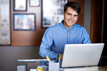 Image showing Businessman, laptop and portrait in workplace professional, salesman and working in office. Male person, smile and happy with computer or research, corporate and technology or connectivity or project