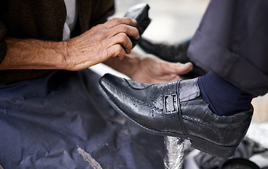 Image showing Street, polish or hands of man with shoes in cleaning service in city for shining with wax, trade and job. Closeup, customer or person with brush in downtown for business, footwear or outdoor help