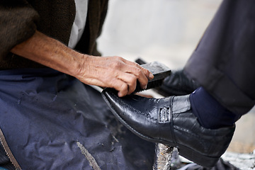 Image showing Hands, repairman and polishing shoes for customer in handcraft, startup business and store. Entrepreneur, shoemaker and service with client for leather footwear, skills and professional in street