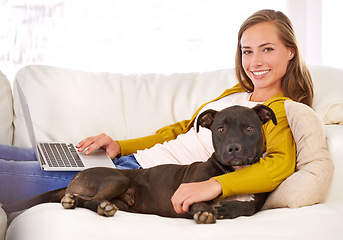 Image showing Portrait, woman and laptop by dog on couch, sofa and relax at home with technology, internet and connection for online blog. Female person, pet and smile in living room, house and apartment