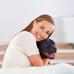 Image showing Smile, portrait and woman with dog on couch for relax, love and happiness together in living room. Female person, cuddle and puppy on sofa for affection, comfort and stress relief by domestic animal