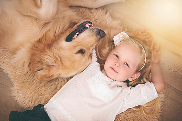 Image showing Girl, dog and love in portrait for bonding, care and pet for support on floor of living room in home. Child, golden retriever and relax with puppy in apartment, top view and companion in childhood