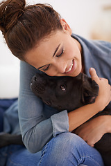 Image showing Dog, woman and hug with smile for animal, pet and together indoor for bonding, affection and friendship. Puppy, lady or owner for laugh and home with love and scratch for adorable, cute and companion