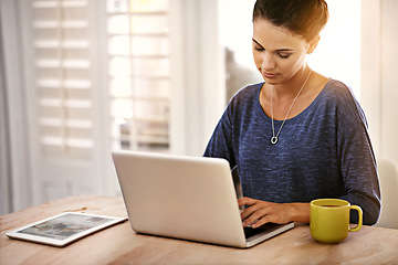 Image showing Woman, laptop and coffee on table or desk at home for remote work, research or startup for job. Entrepreneur or blogger with journalist article for tech, typing and email with internet and online