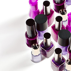 Image showing Nail polish, purple and bottle on a white background for salon, cosmetics and beauty products. Cosmetology, luxury spa and container for painting nails for manicure, pedicure and pamper in studio