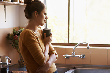 Image showing Thinking, woman and drinking coffee in home kitchen to relax, peace and planning future at breakfast in the morning. Dream, tea cup and young person with latte, espresso or hot beverage in apartment