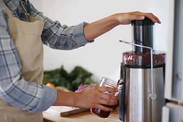 Image showing Person, hands and kitchen with juicer, blender or mixer for fruit, smoothie or nutrition at home. Closeup of nutritionist mixing ingredients, vitamins or vegetables in food processor or jar for drink