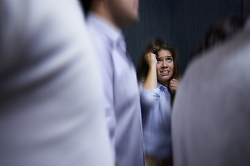 Image showing Woman, people and trapped with social anxiety at work with stress, scared and overthinking with concern. Female person, coworkers and crowd with worry for deadline at office and stuck at office