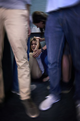 Image showing Crowd, female person and fear of social anxiety, screaming or crying in corner. Student, scared or trapped with anthropophobia or stress or worry and woman with hand reaching to help in motion blur