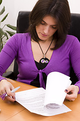 Image showing businesswoman signing documents