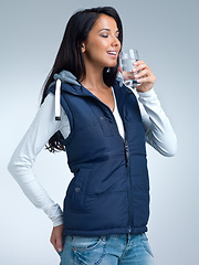 Image showing Woman, water for health and hydration in studio, nutrition and wellness with drink for thirst on grey background. Liquid, aqua and mineral with h2o in glass, fresh and clean for refreshment and detox