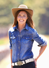 Image showing Happy woman, portrait and cowgirl with hat on farm for adventure, travel or outdoor journey in Texas. Female person with smile in western fashion, denim shirt and cap at ranch in the countryside