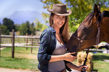 Image showing Cowgirl, portrait and happy woman with horse at farm outdoor in summer or nature in Texas for recreation. Western hat, face or person with animal at ranch, pet or stallion in the rural countryside