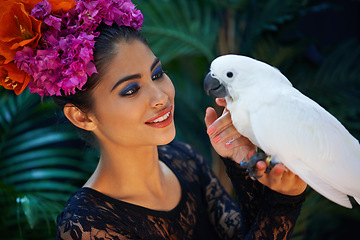 Image showing Jungle, bird or woman with flowers or parrot, natural cosmetics for wellness in nature aesthetic. Smile, face or happy female Indian model in rainforest for skincare beauty, pet animal or floral art