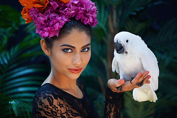 Image showing Jungle, portrait or woman with flowers, bird or natural cosmetics for wellness in nature aesthetic. Outdoor, face or female Indian model in rainforest for skincare beauty, pet animal or floral art