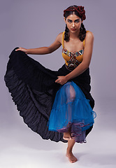 Image showing Portrait, flamenco or woman in dress to dance with energy, freedom or fashion for Spanish style. Creative, purple background or artist in studio, tango or performance in musical culture or tradition