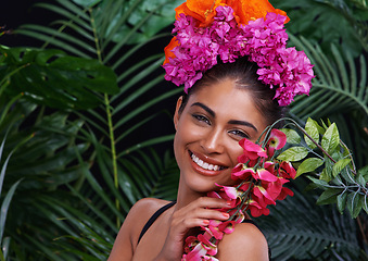 Image showing Happy, portrait or woman with flowers for natural beauty, makeup and wellness in nature or jungle. Color, Indian person or face of model with eco friendly skincare, smile or plants for floral art