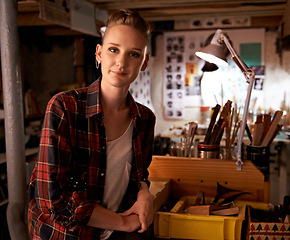 Image showing Artist, studio and portrait of woman in workshop for creative sculpture or project at night. Artisan, workplace or person with pride as carpenter with talent for working with tools in woodwork