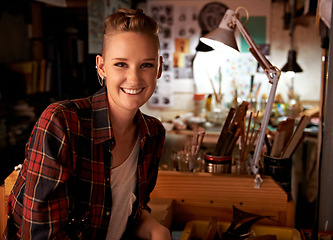 Image showing Artist, workshop and portrait of happy woman in studio to work on creative sculpture or project at night. Artisan, workplace or person with pride or confidence as carpenter with talent and tools