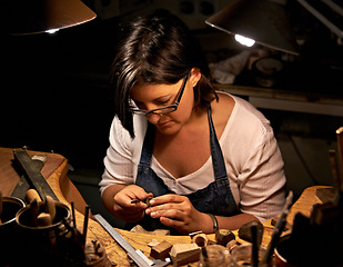 Image showing Artist, woman and tools with woodwork in workshop with craftsmanship, skill and handmade design with creativity. Wood, carpenter or creative person at workspace with equipment for handicraft or hobby