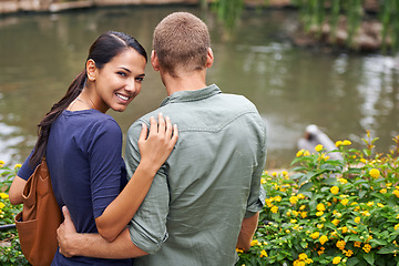 Image showing Couple, hug and love or portrait at park, relationship and care on outdoor adventure or holiday. People, happy and embrace on vacation and romance at sanctuary, zoo and calm or peace on weekend trip