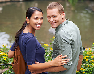 Image showing Couple, hug and date or portrait at park, relationship and care on outdoor adventure or holiday. People, love and embrace on vacation and romance at sanctuary, zoo and calm or peace on weekend trip