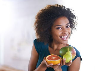 Image showing Smile, wellness and portrait of woman with fruit for fresh, organic or nutrition snack for diet. Happy, health and young female person with produce ingredients or groceries at modern apartment.