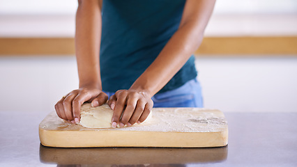 Image showing Woman hand, home and dough for wellness, eating and health in baking and cooking lifestyle. African female person, kitchen and healthy food for meal prep, fingers and nutrition at house indoor