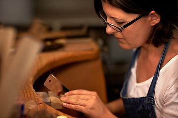 Image showing Woodworking, industry and woman in workshop for creative project, furniture or sculpture. Artisan, industrial and young female carpenter manufacturing craft or products in studio for small business.