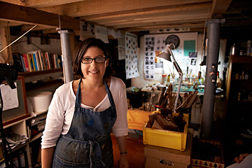 Image showing Artist, workshop and portrait of happy woman in studio to work on creative sculpture or project at night. Artisan, workplace or person with pride or confidence as carpenter with talent and tools